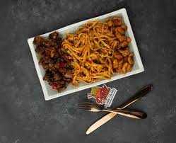 ASUN PASTA Glow cooked spicy goat meat served in tomatoes base spaghetti with veggies.